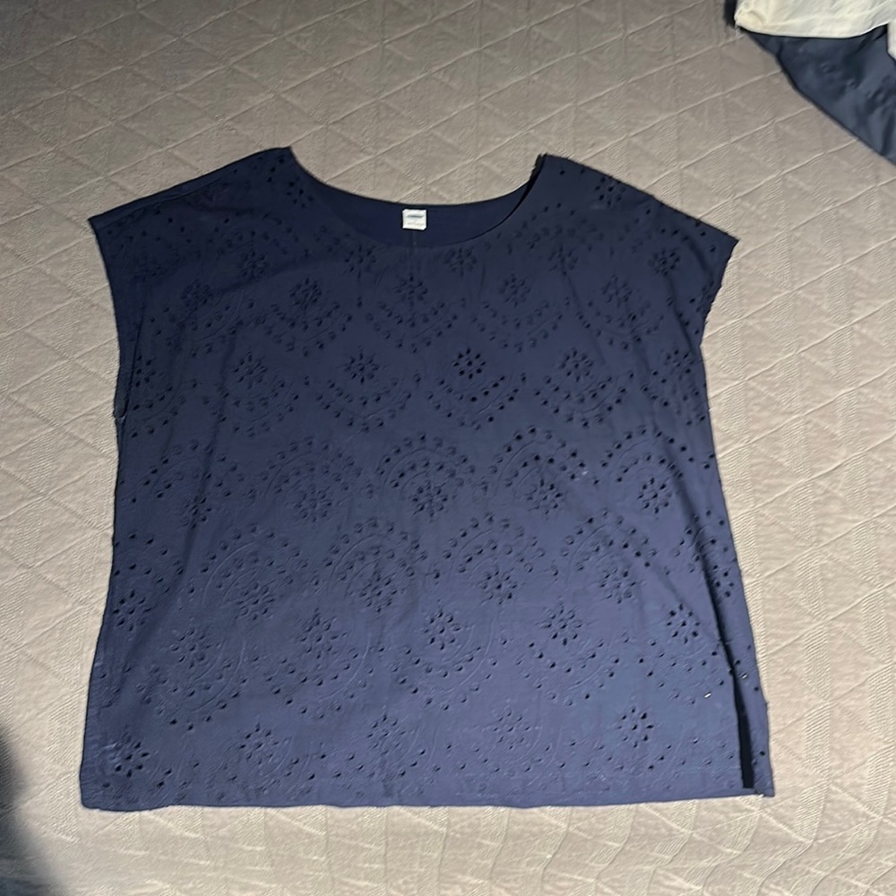 Navy eyelet front short sleeve blouse. Perfect to dress up or pair with jeans